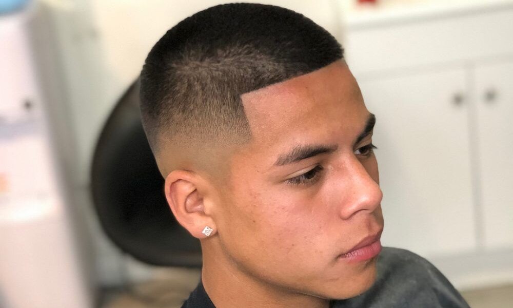 Close-up of a detailed buzz cut with precise fade