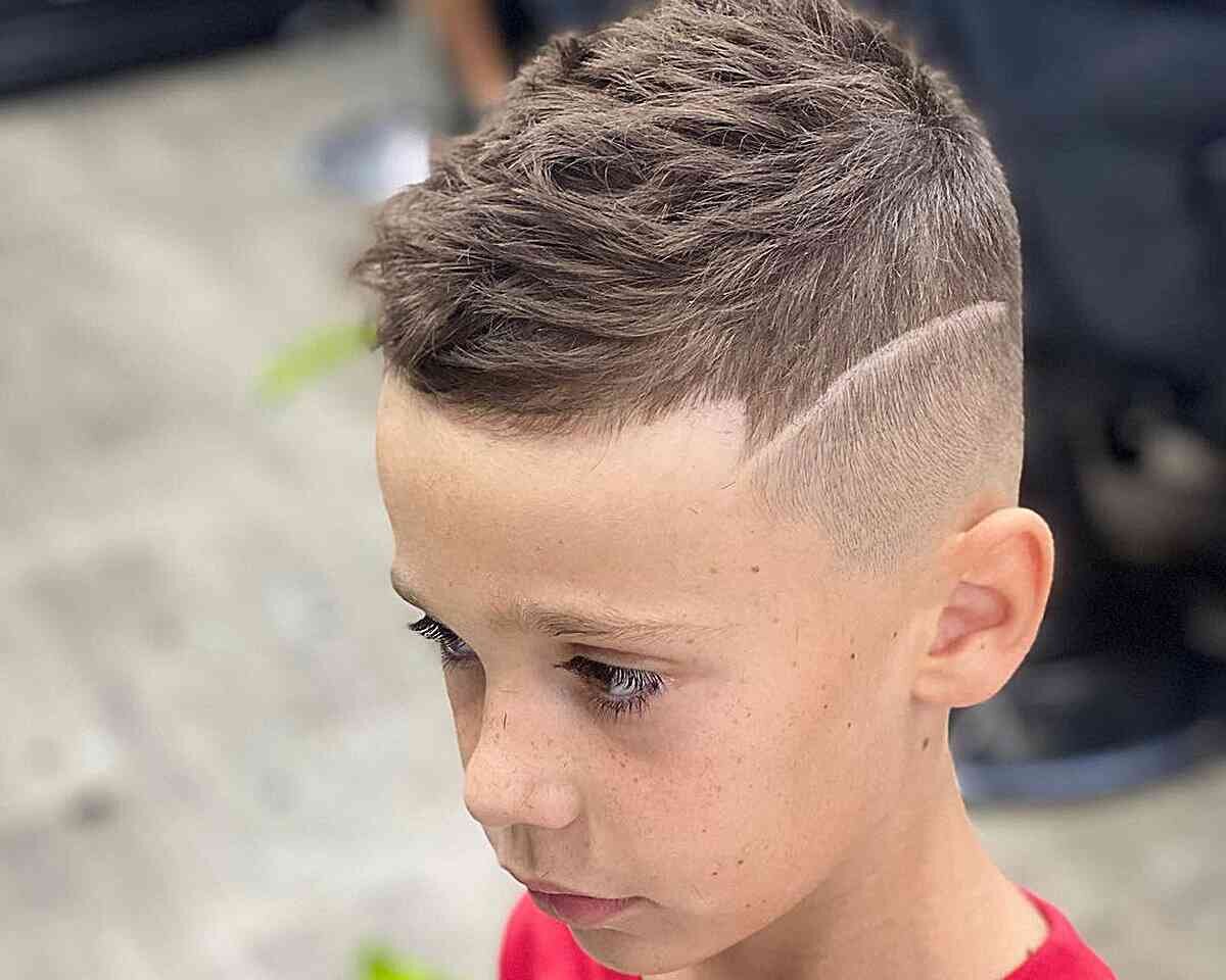Boy with creative haircut designs lines
