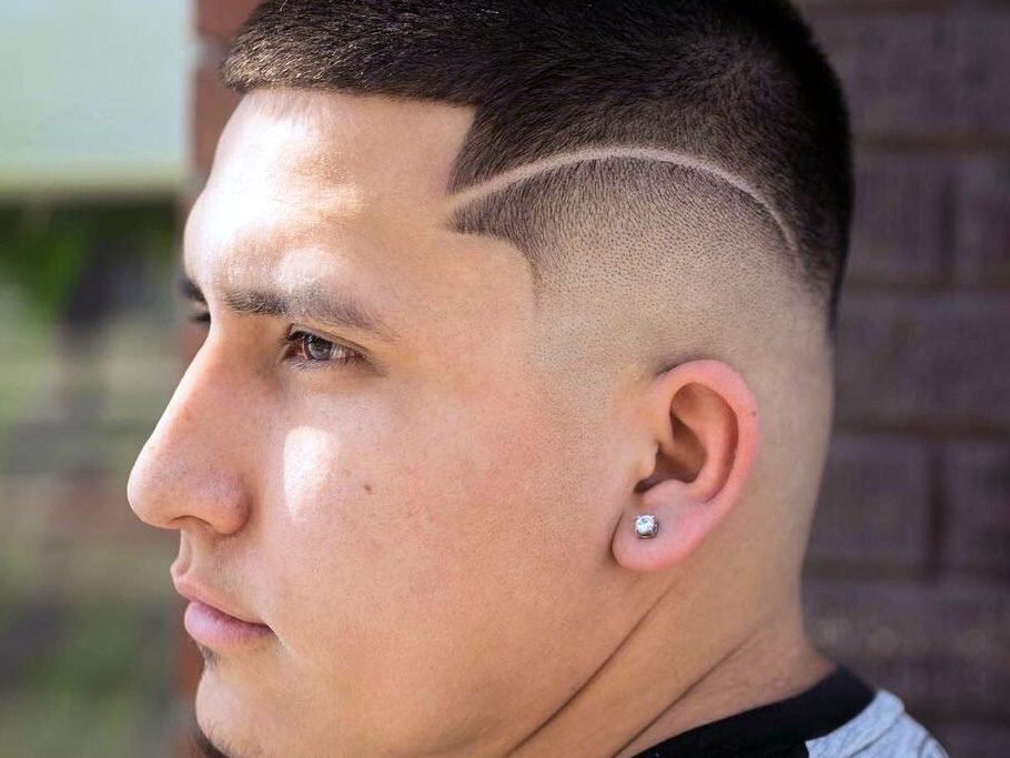 Detailed fade with haircut lines designs