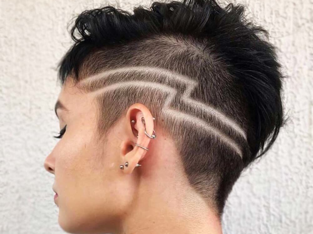 Woman with abstract line design in short hair