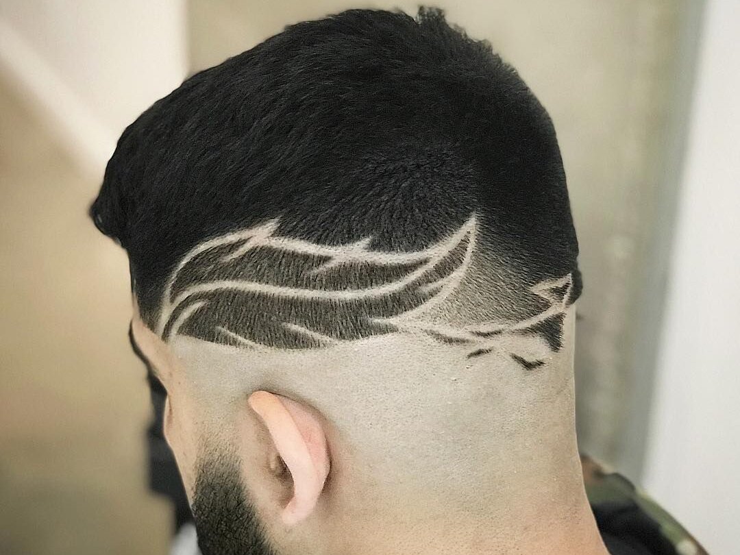 Man with creative haircut designs lines